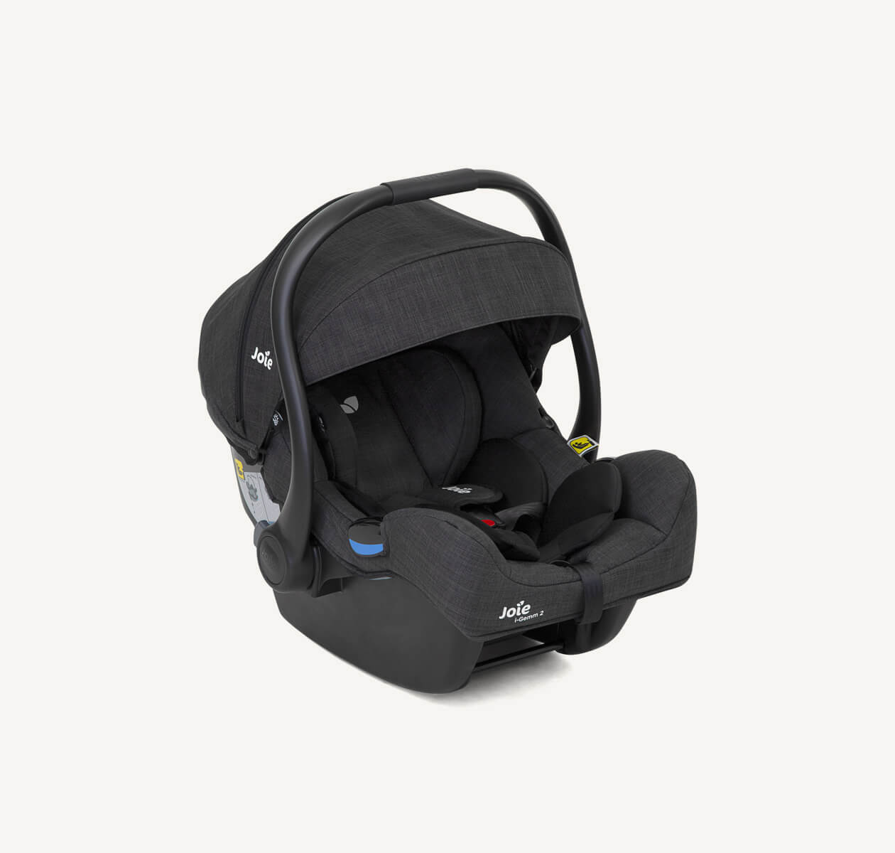 Black Joie I-Gemm infant car seat at an angle facing toward the right zoomed in on the infant headrest.