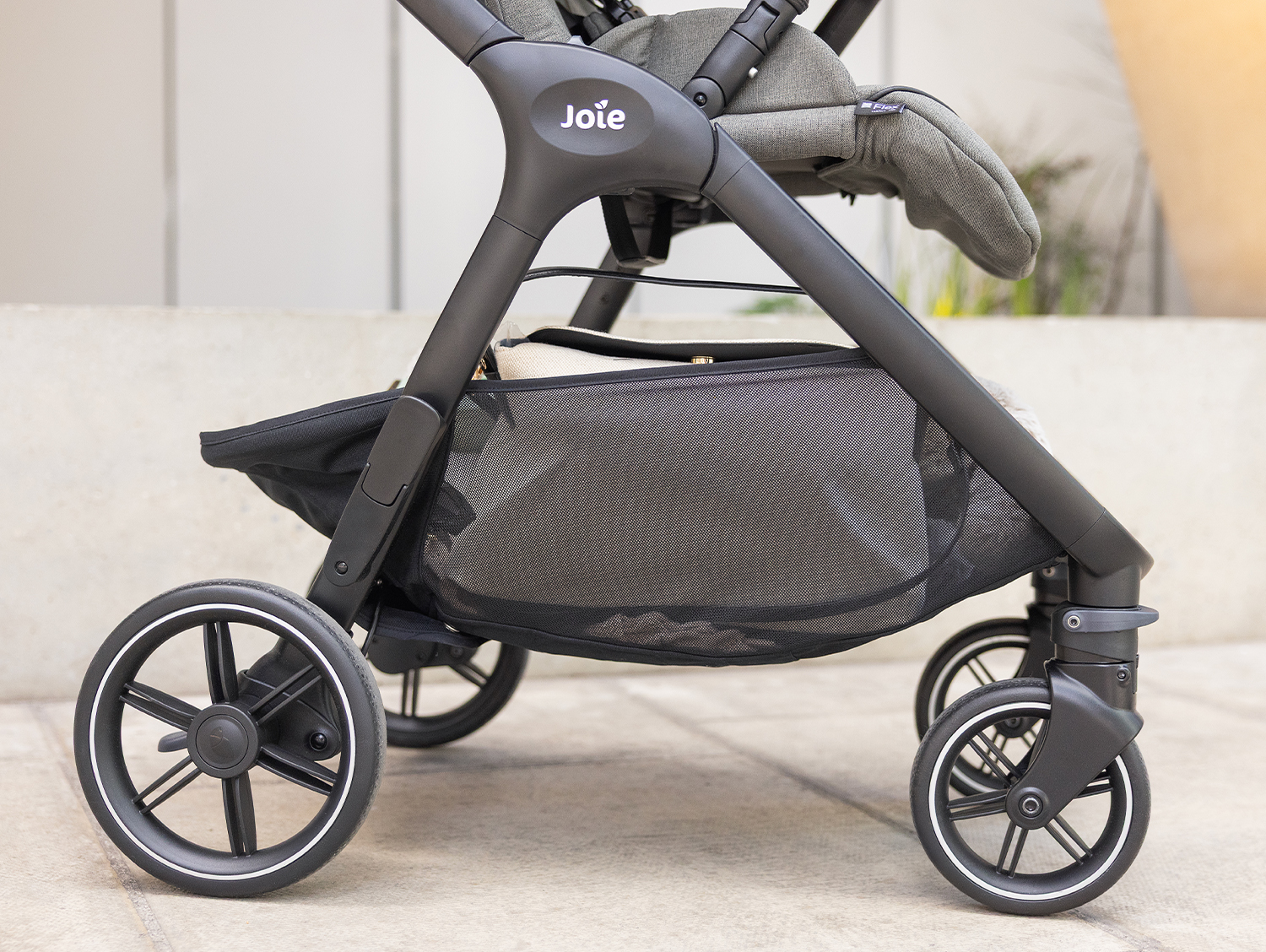 Close up of the all-suspension wheels of the Joie valora pushchair