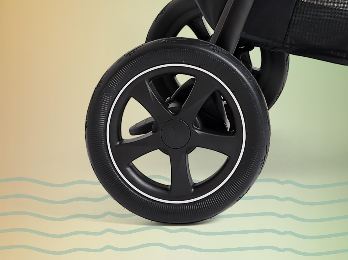 Close up of PunctureProof tires on yellow to green gradient background.