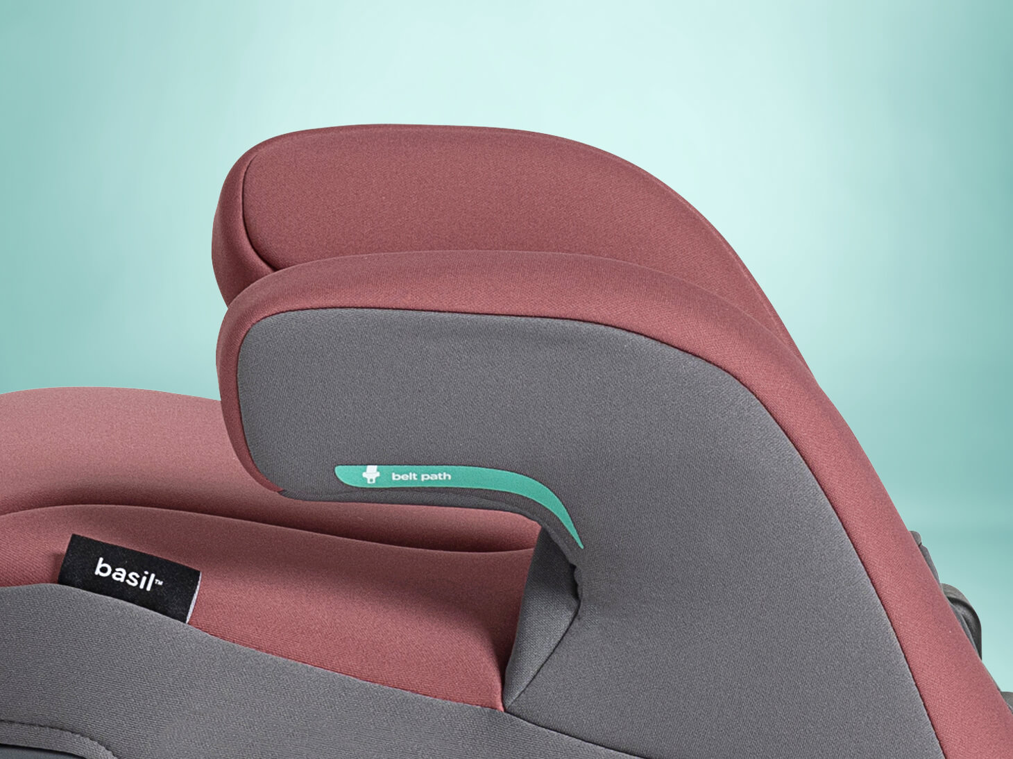 Close up of padded armrests on basil backless booster on light blue background