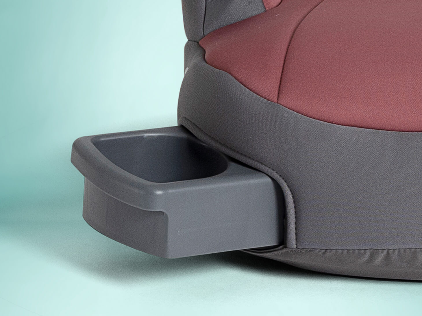 Close up of cupholders on basil backless booster on light blue background