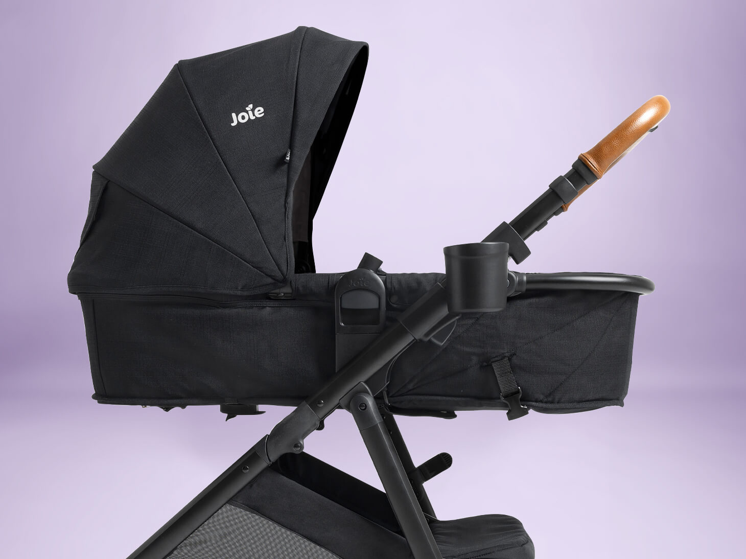 Ginger 4-in-1 pramette stroller on purple background
