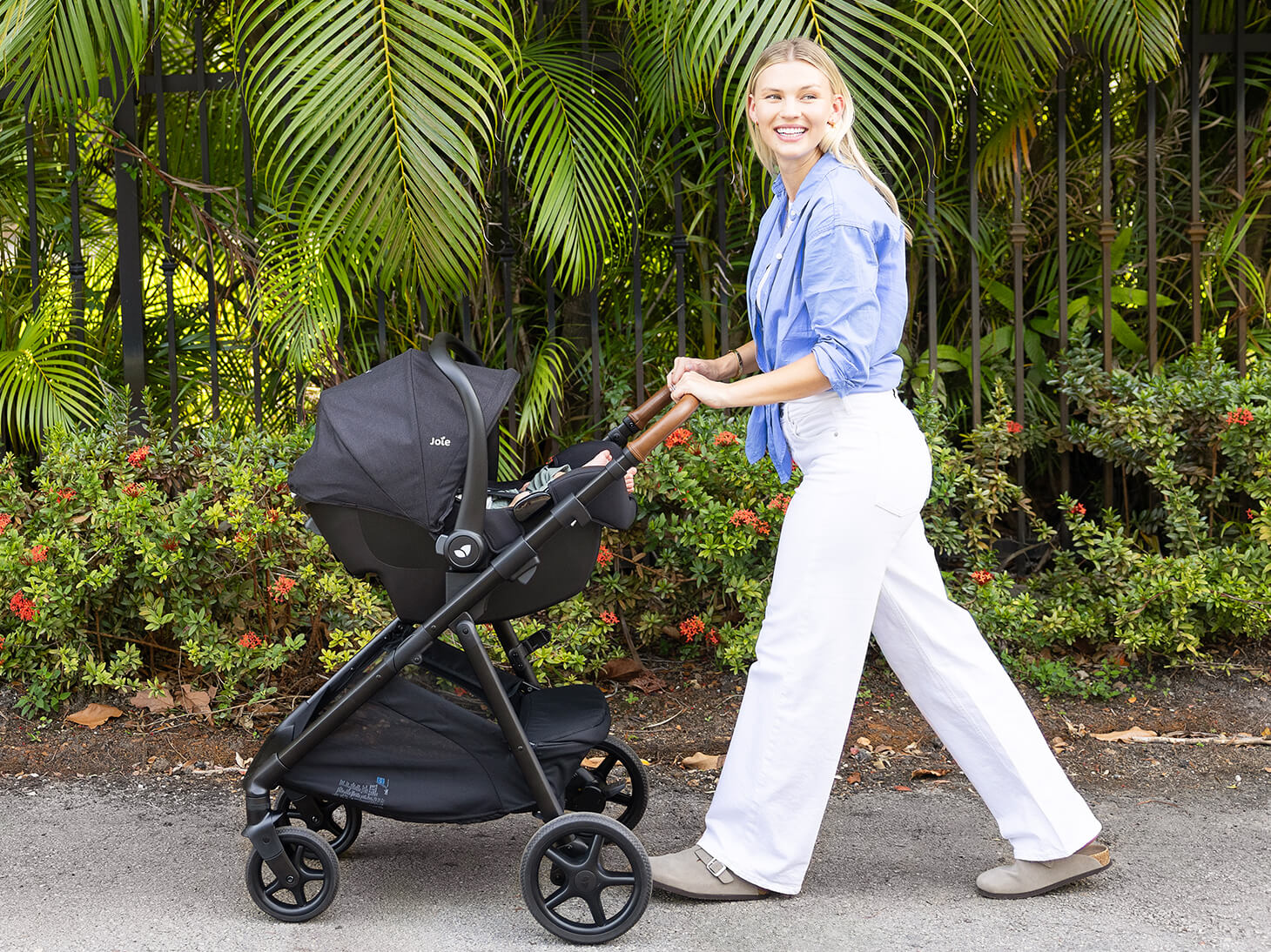 Lifestyle of baby in rue infant car seat on travel system
