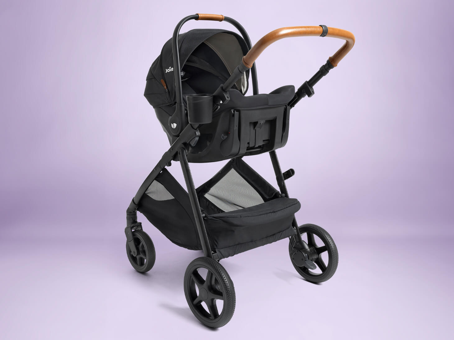 Ginger 4-in-1 height adjustable stroller in travel system mode on purple background
