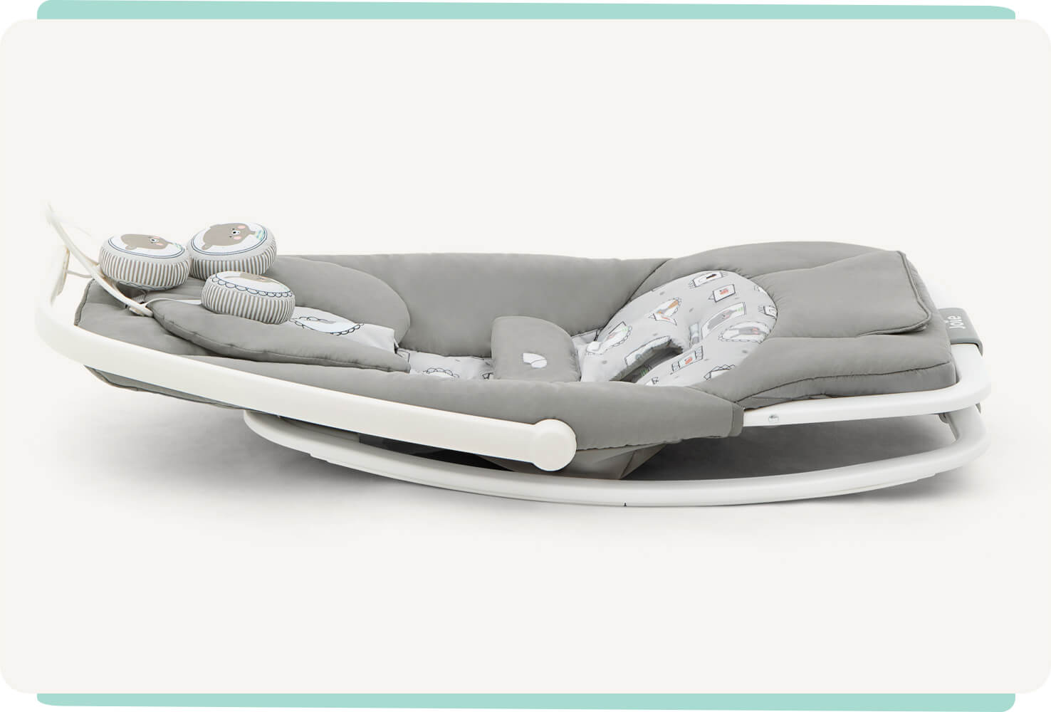  Grey patterned dreamer Joie bouncer lying flat on the ground to display compact feature.