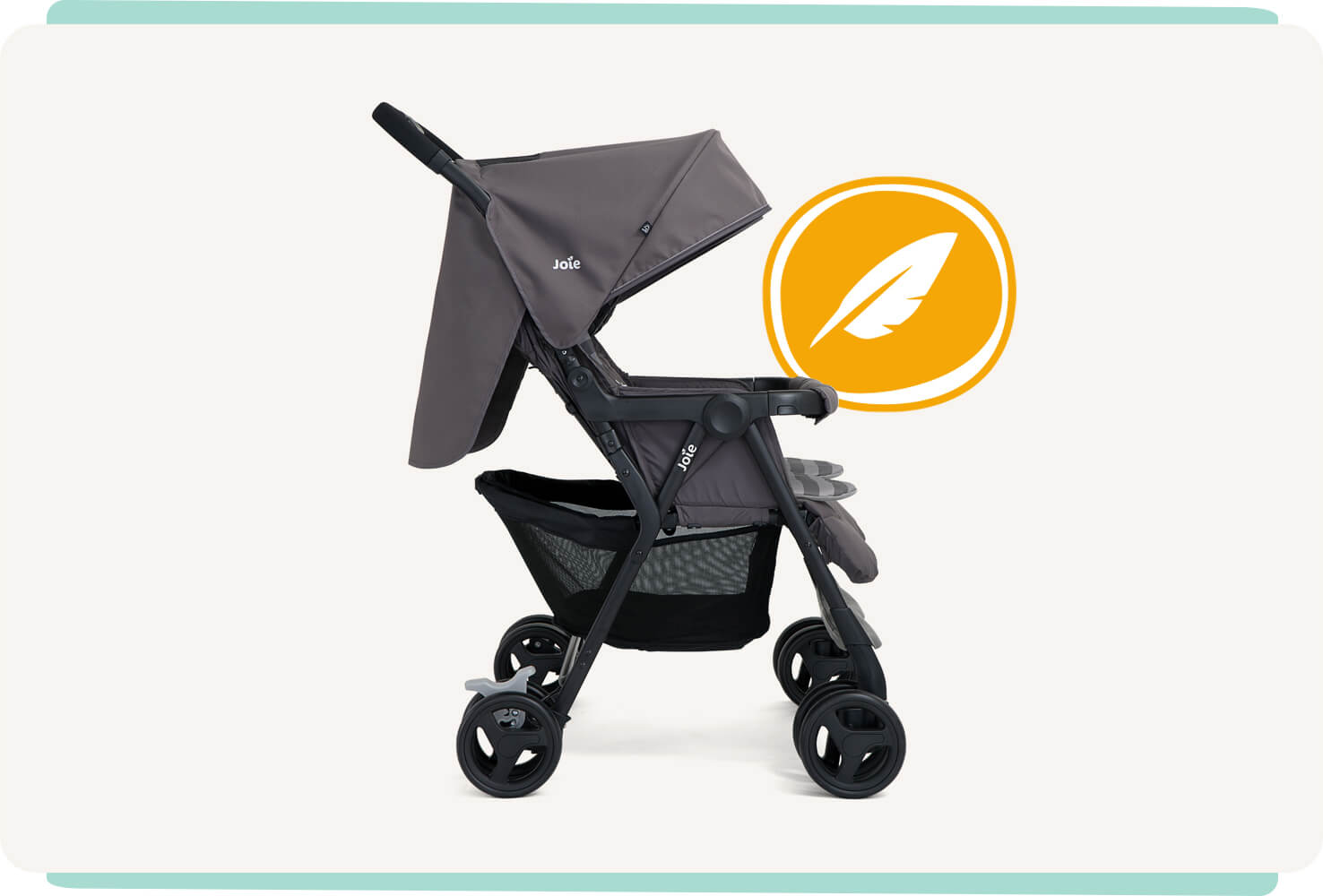  The Joie Aire Twin double stroller in dark gray, in profile facing to the right, sitting next to an orange circle with a white outline and a white feather icon inside.