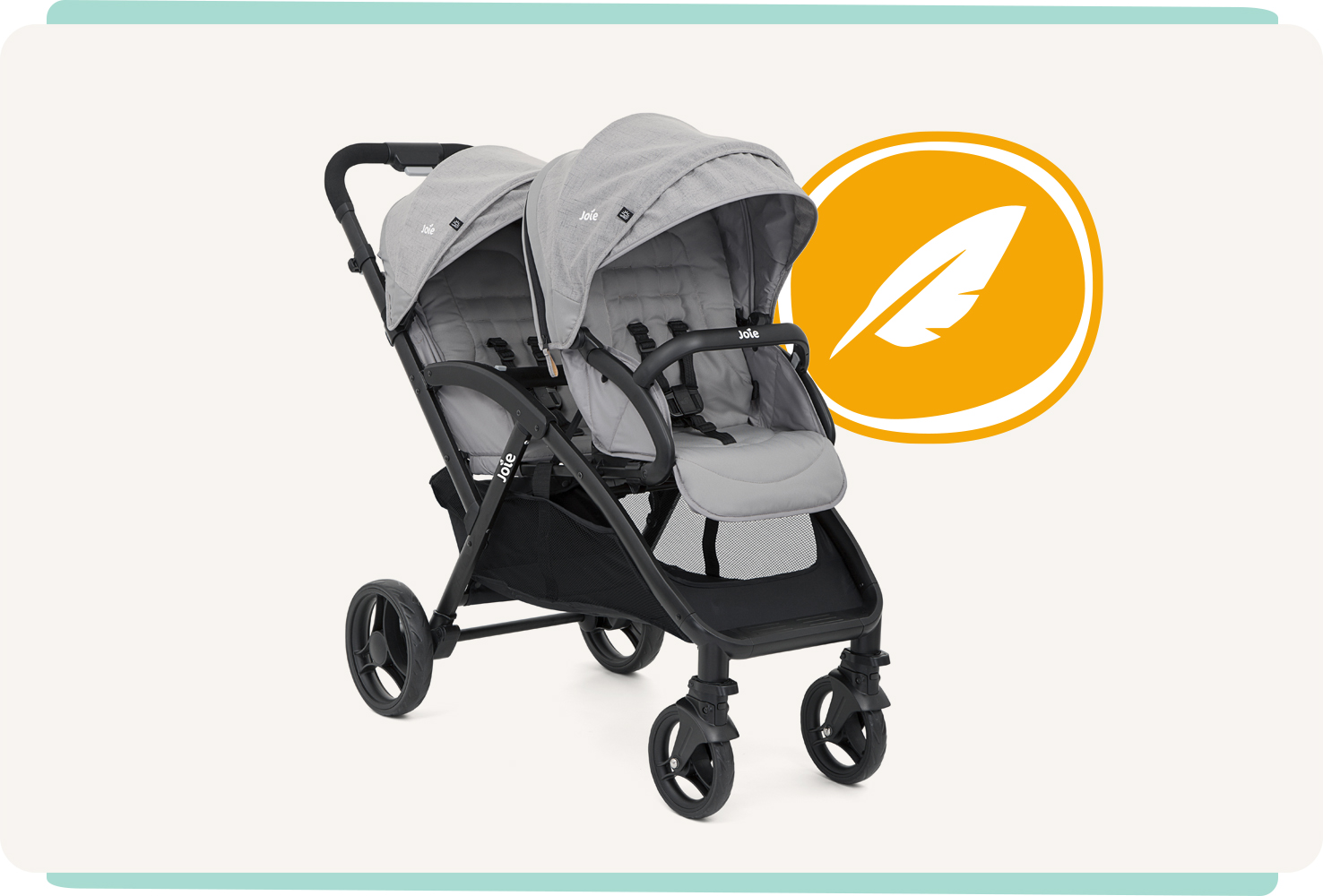 Joie evalite duo double buggy in gray from a right angle with a feather icon behind it.