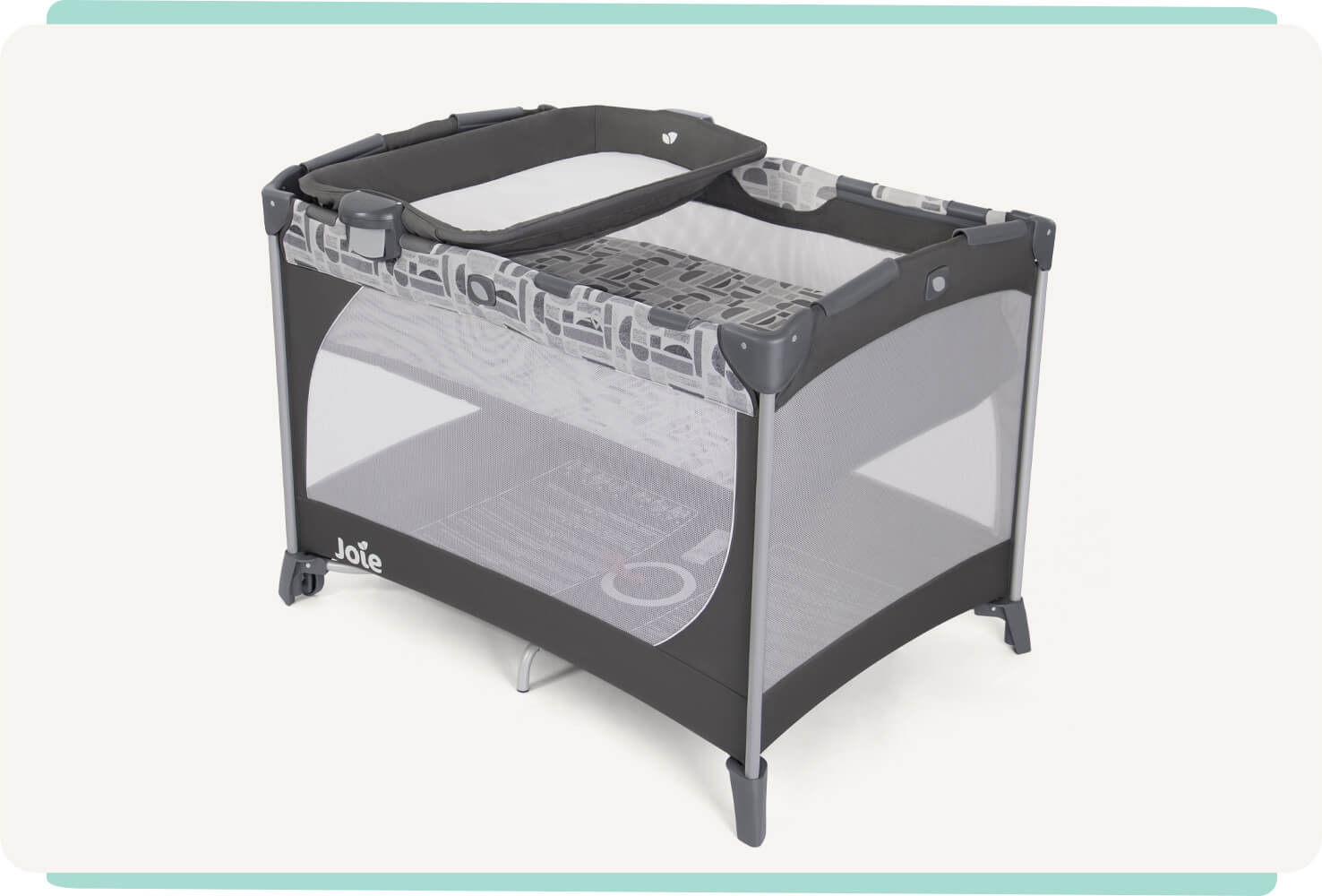 The Joie travel cot commuter change in grey and blue pattern with a bassinet and changer at a right angle.