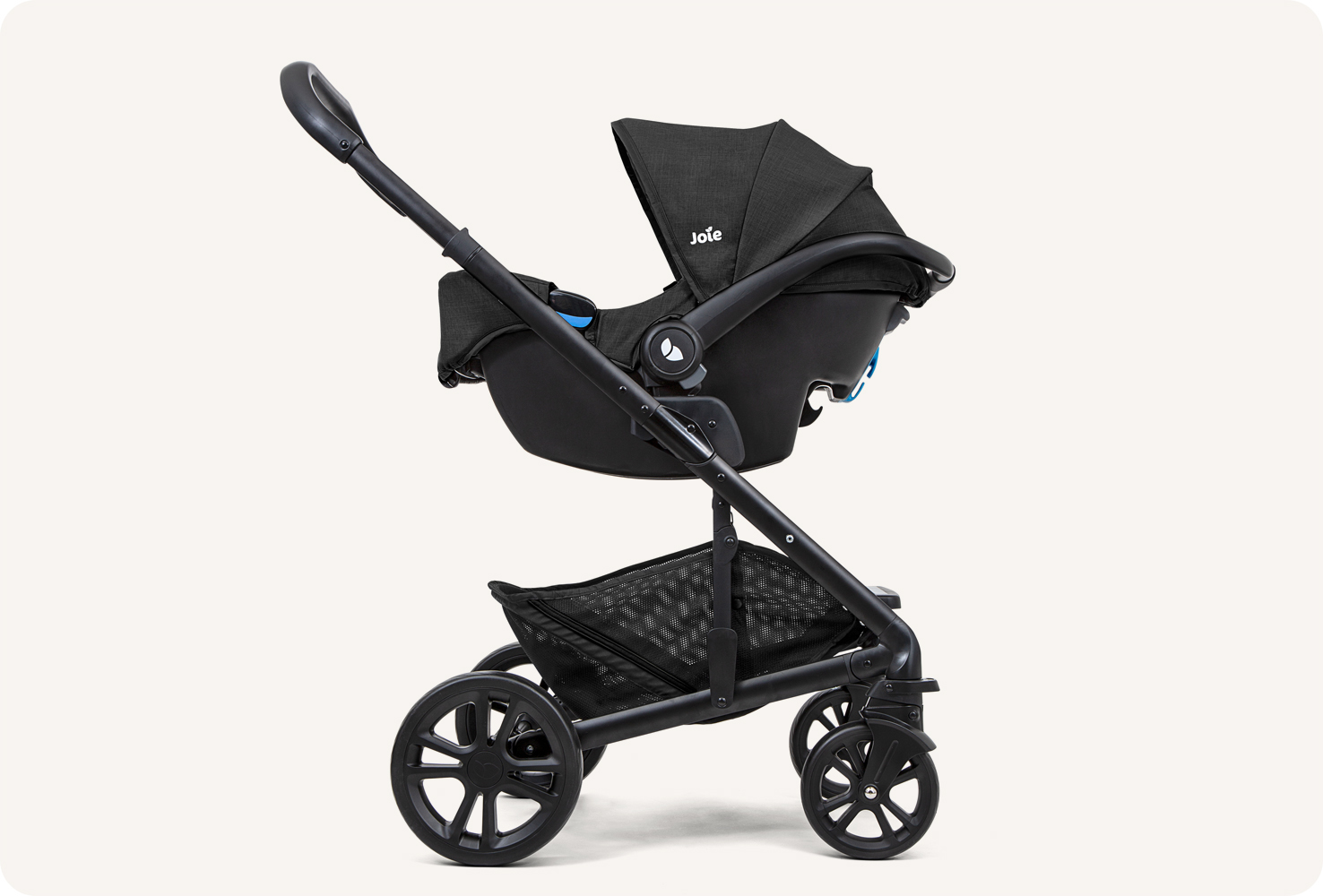  Left profile view of Joie gemm baby car seat in black on a stroller base as a travel system. 