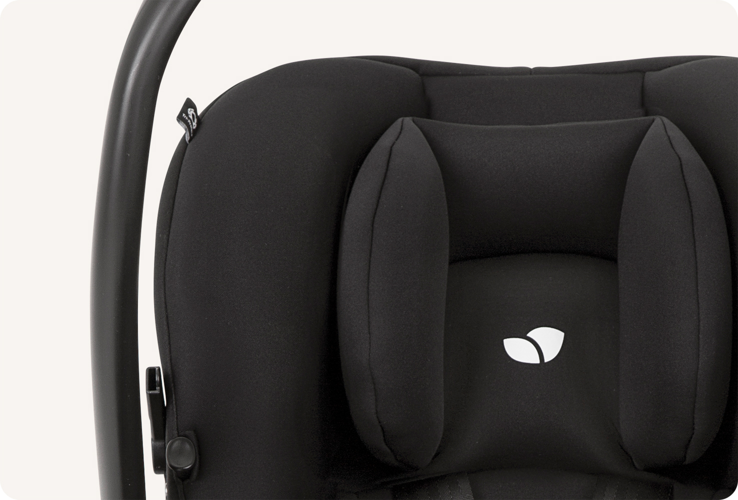  Joie I-snug 2 infant car seat in a two-tone black colour in a close up of headrest on front position. 