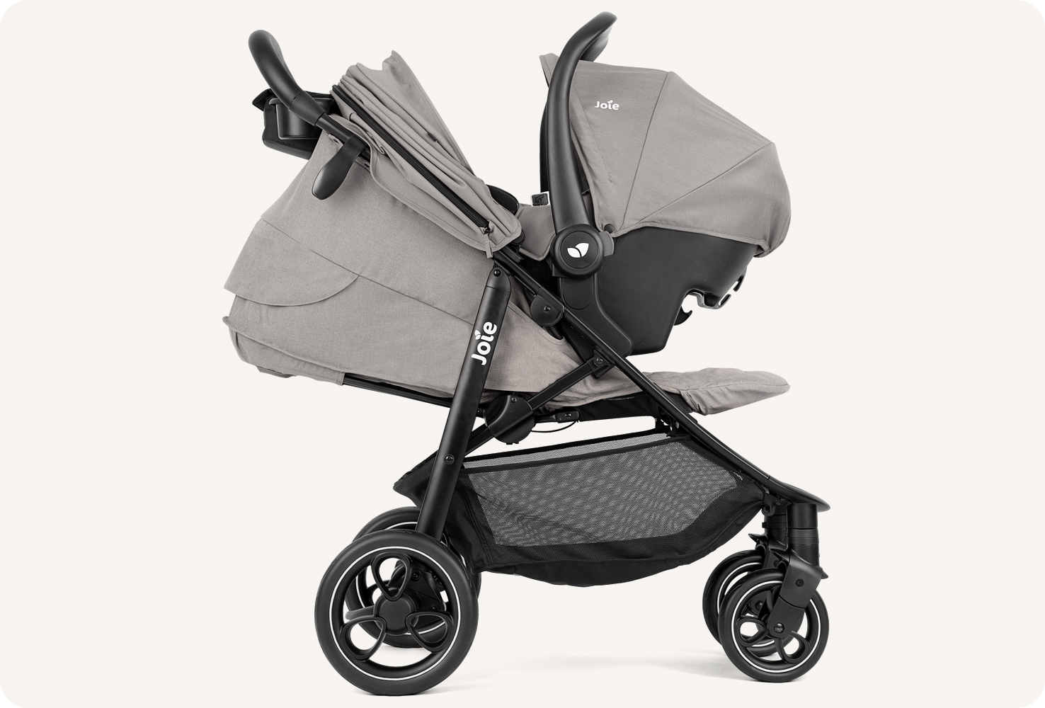  Joie litetrax pro stroller in gray facing right with infant carrier attached. 