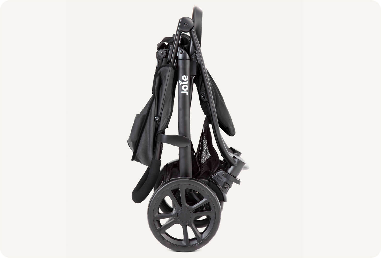Black Joie Litetrax E stroller folded, in profile.