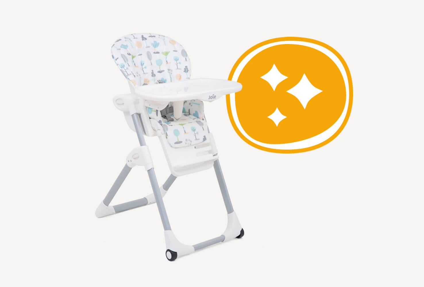  The Joie mimzy highchair in a multi-color print featuring illustrations of different trees from a right angle view beside an illustration of an orange circle with three white star shapes inside.