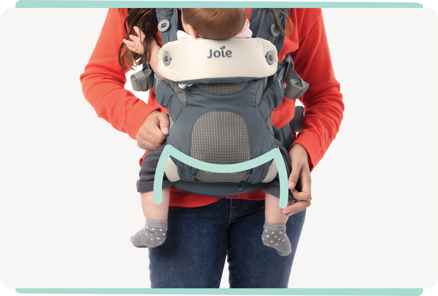 Closeup of a baby in a blue Joie Savvy 4in1 baby carrier with a mint colored line indicating the M shape of the baby’s hips