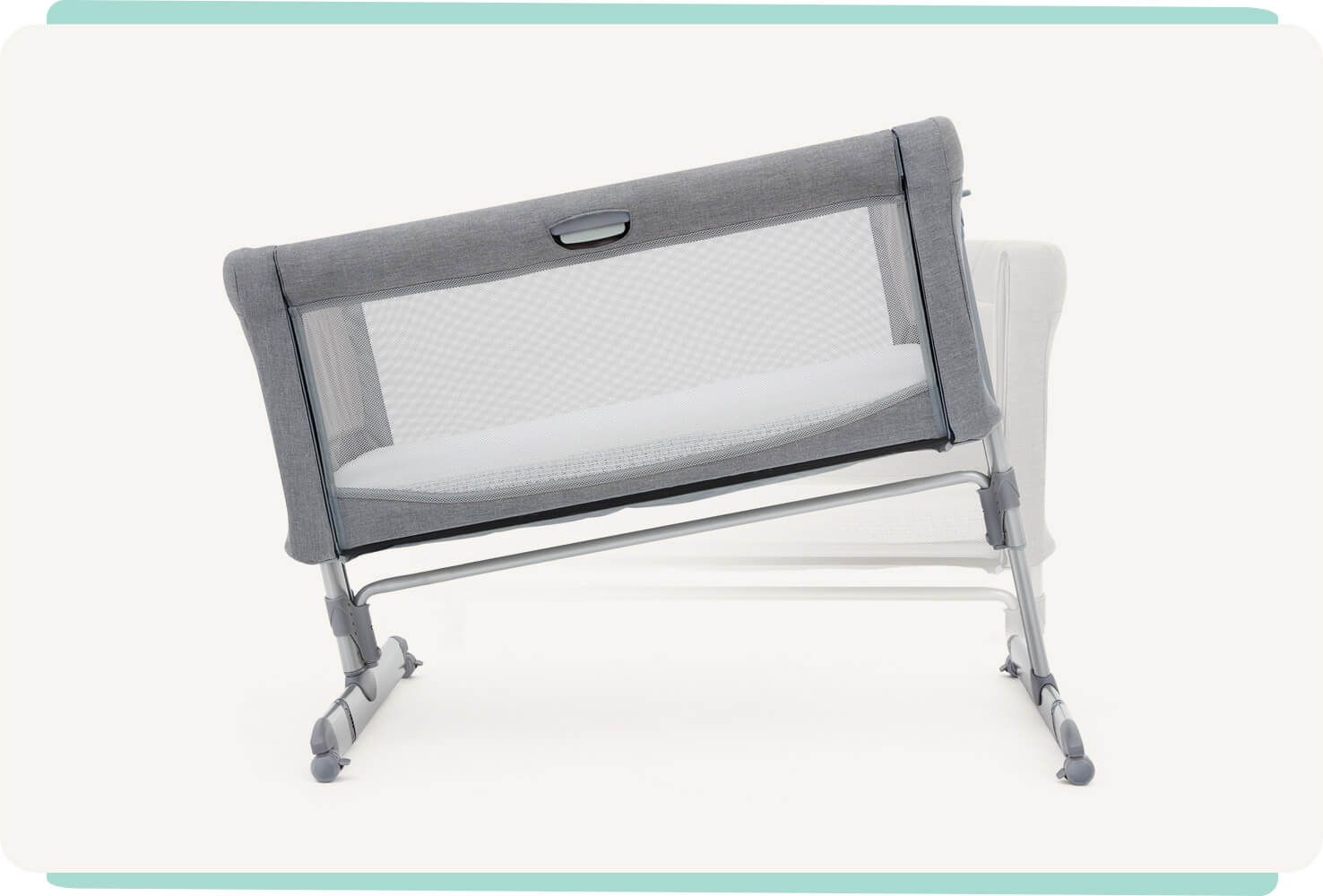   Light gray Joie roomie bedside crib tilted to show different angled positions.