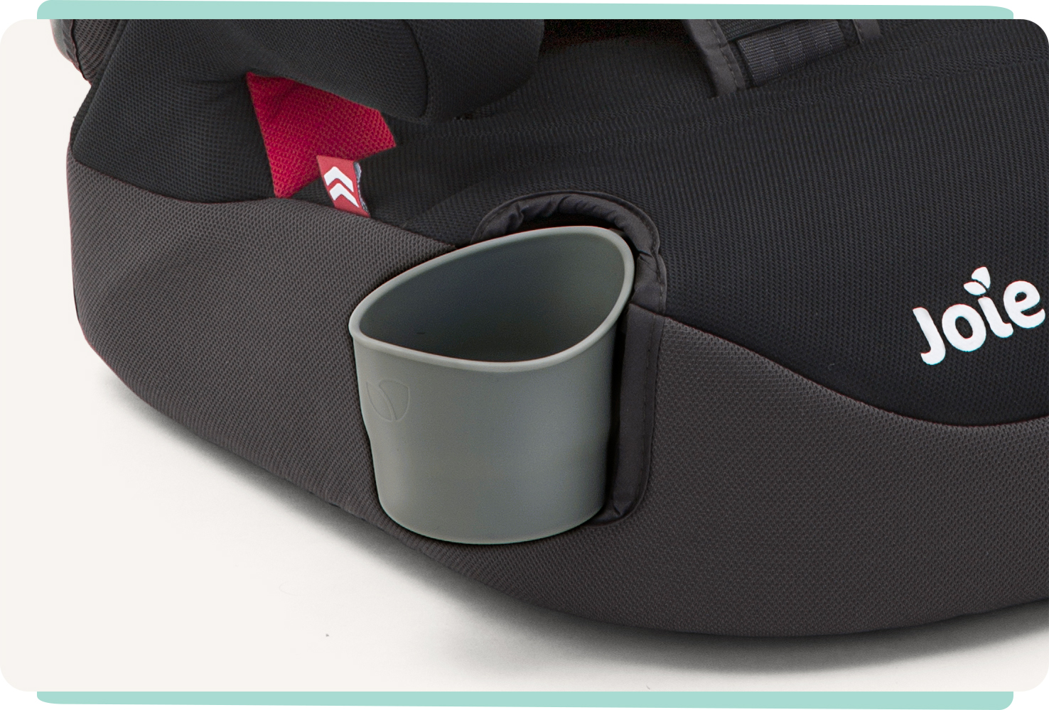  Closeup of gray plastic cupholder on a black Joie Elevate booster car seat.