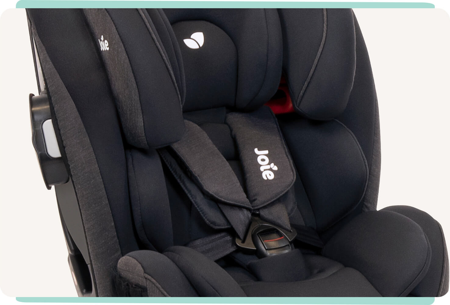 Closeup of a light black Joie Every Stage FX car seat showing the 5-point harness and infant insert.