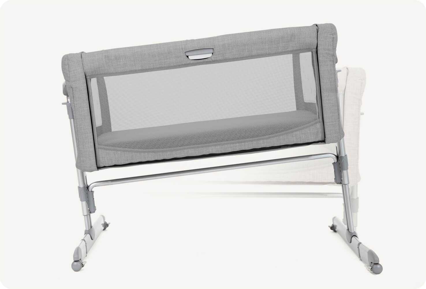   Front view of light grey Joie roomie glide bedside crib, displaying tilt feature.