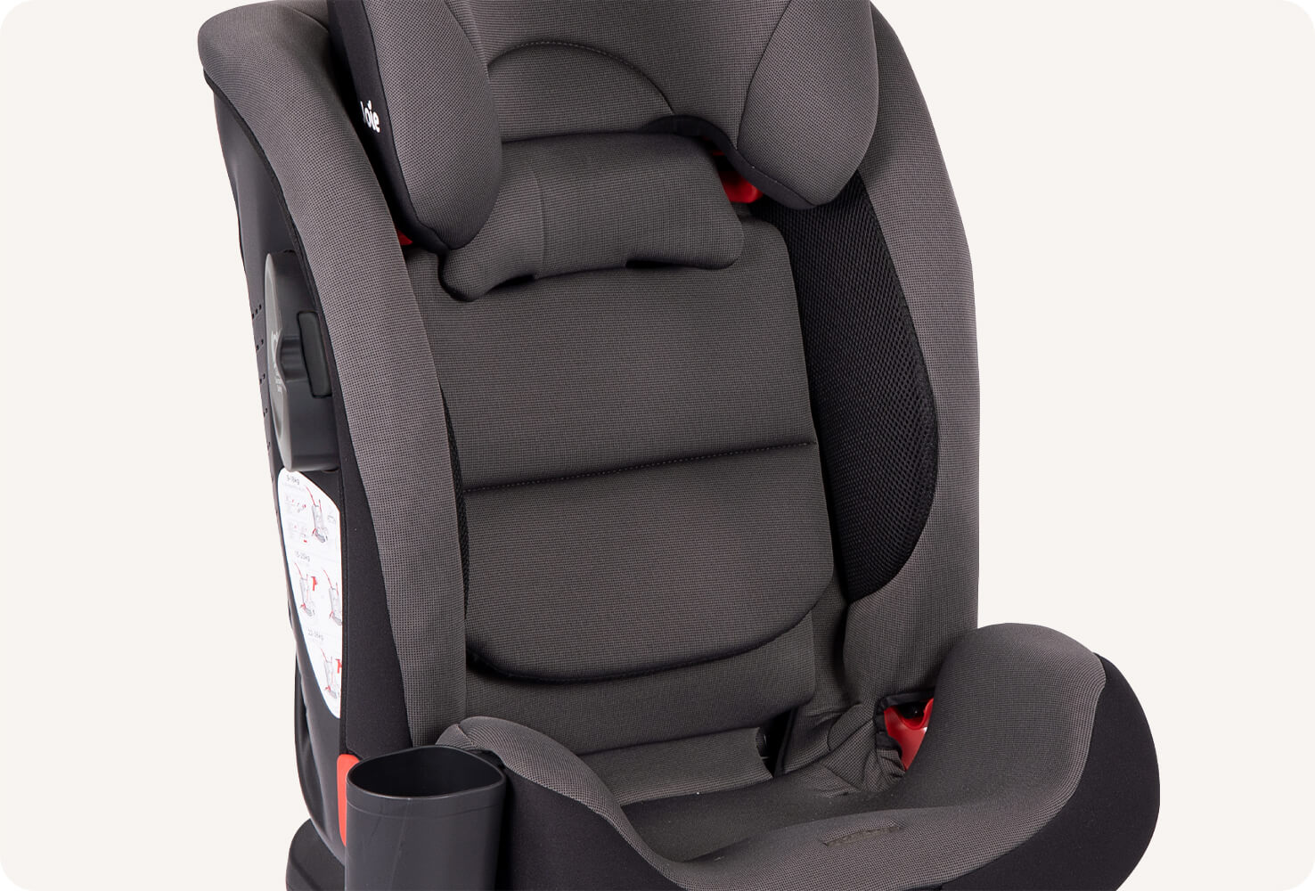 Close-up of the lower half of a dark gray Joie bold R toddler car seat to show the attached cup holder.