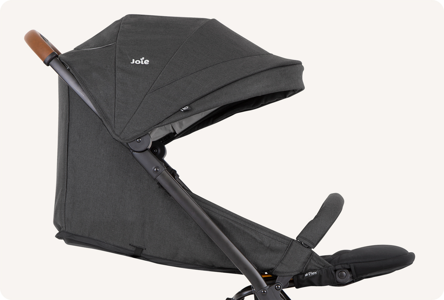 A black Joie Pact Flex stroller with the seat fully reclined.