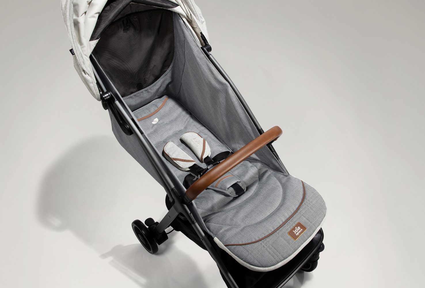 Overhead view of the Joie Parcel pushchair fully reclined with the canopy retracted