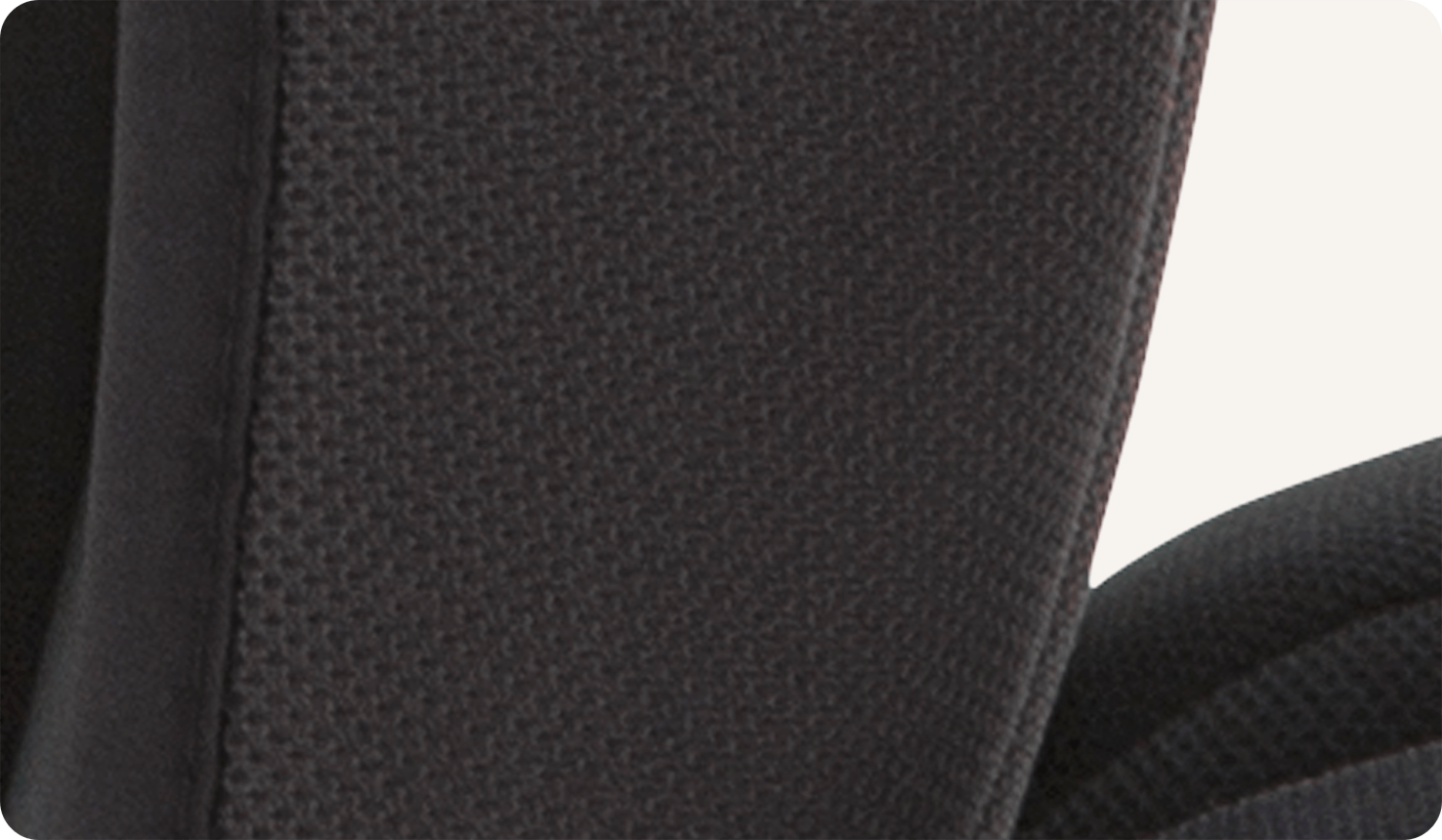  Closeup of black mesh ventilated fabric on the Joie Elevate booster car seat.