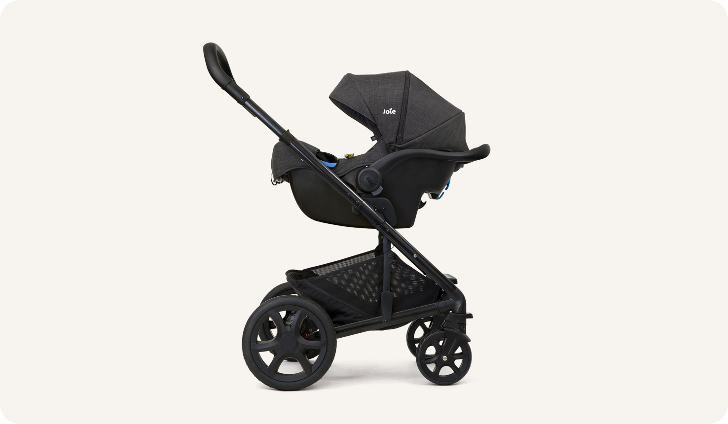 Black Joie I-Gemm infant car seat in profile facing to the left on a stroller.