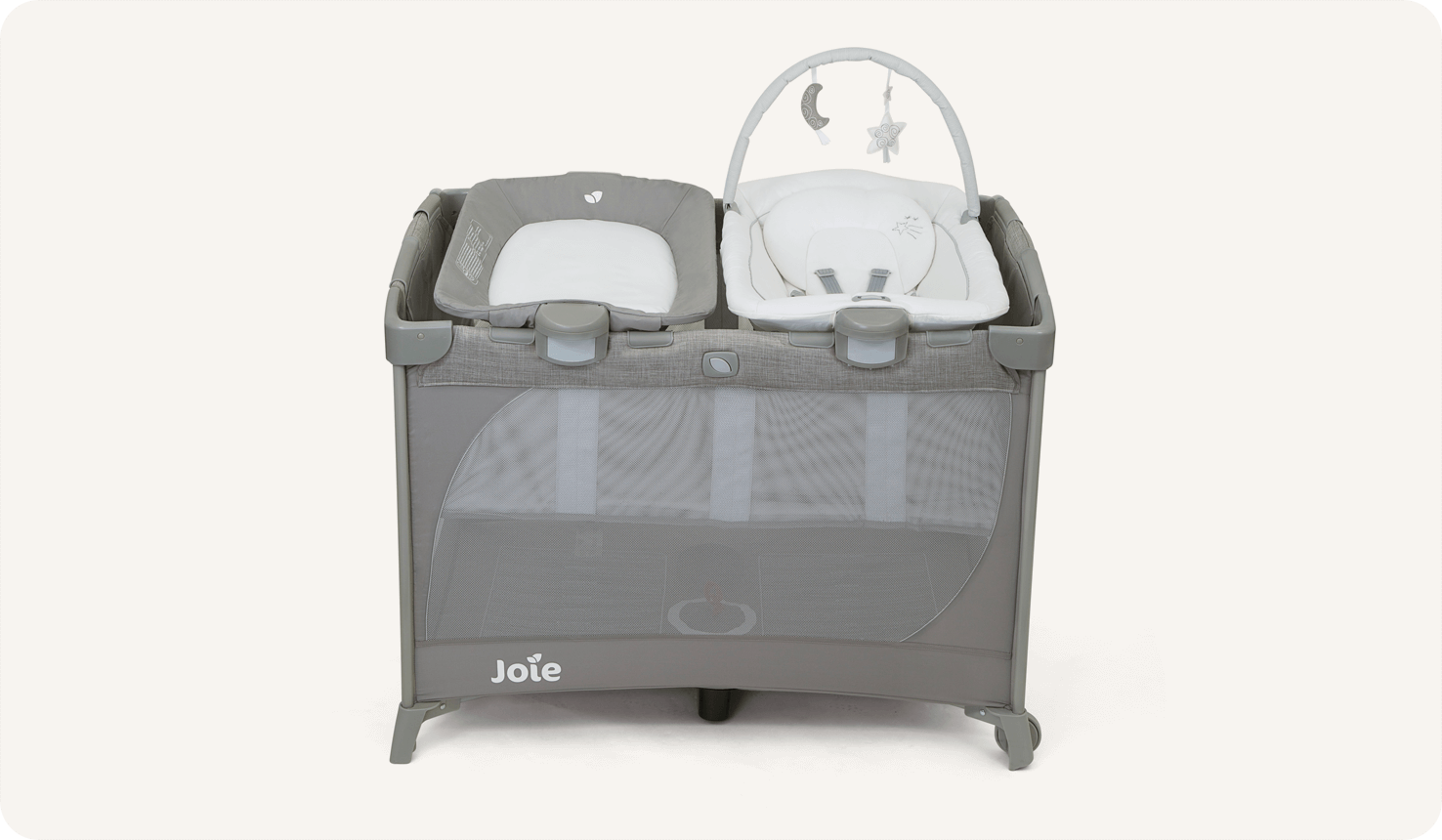 Joie travel cot commuter change & bouncer in grey with bassinet, changer, and bouncer seat at a high side profile.