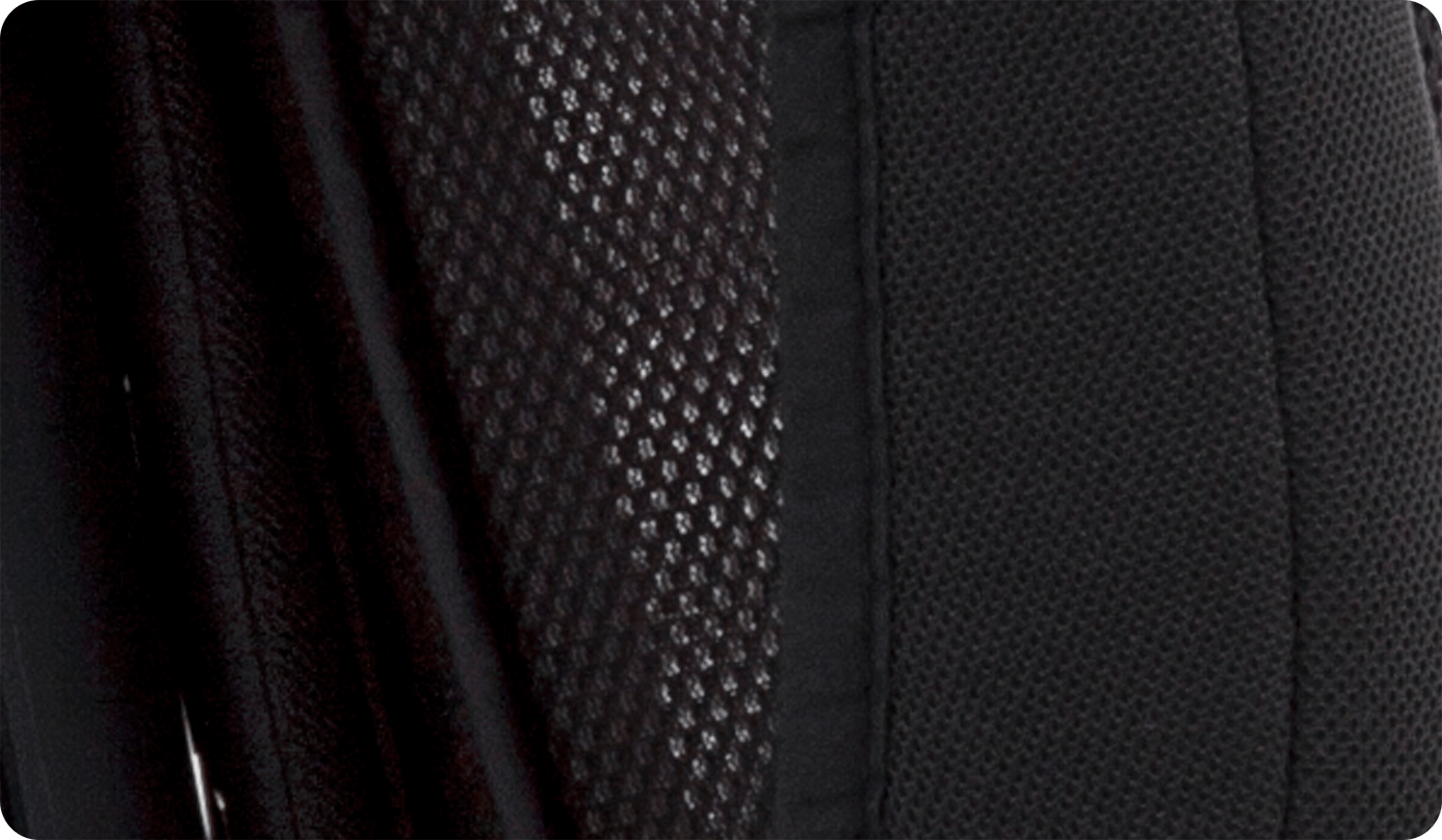  Closeup of black mesh ventilated fabric on the Joie Elevate booster car seat.