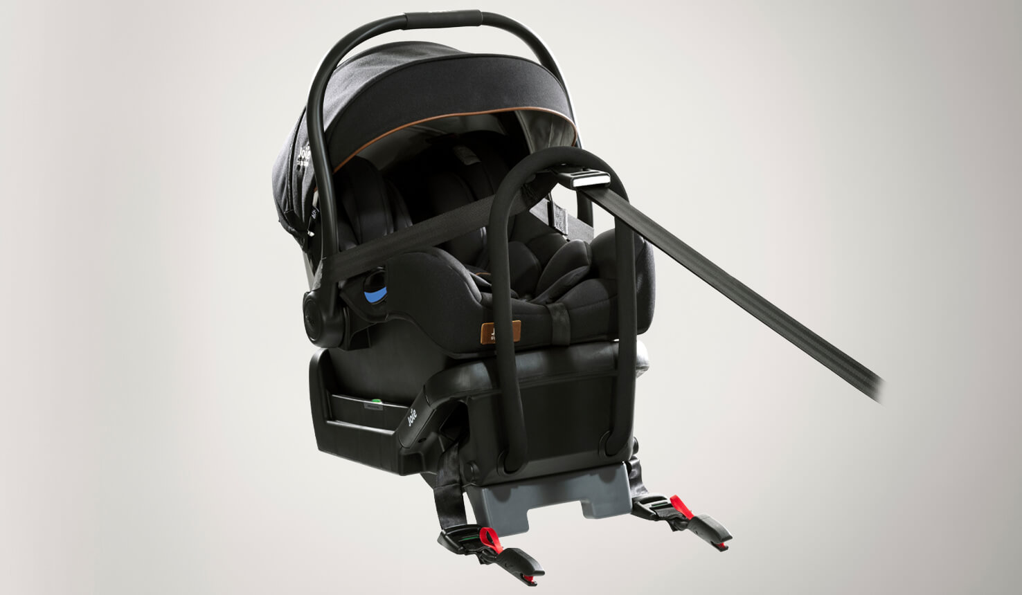 Black Joie I-Gemm infant car seat in profile on an angle facing to the right, attached to the I-Gemm base in black.