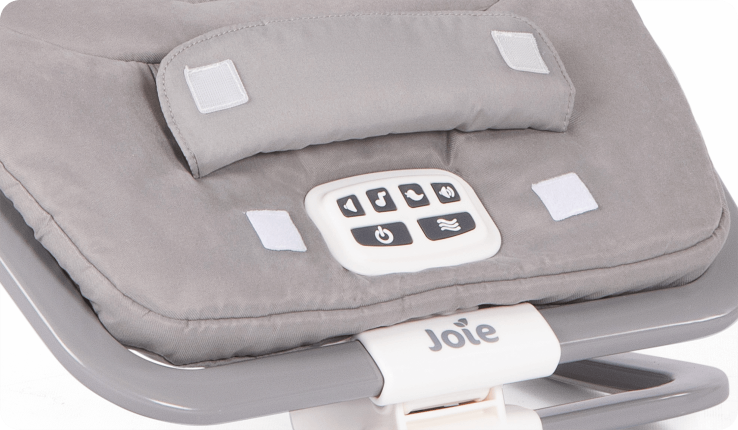 Zoomed in on music control buttons of grey patterned dreamer Joie bouncer.
