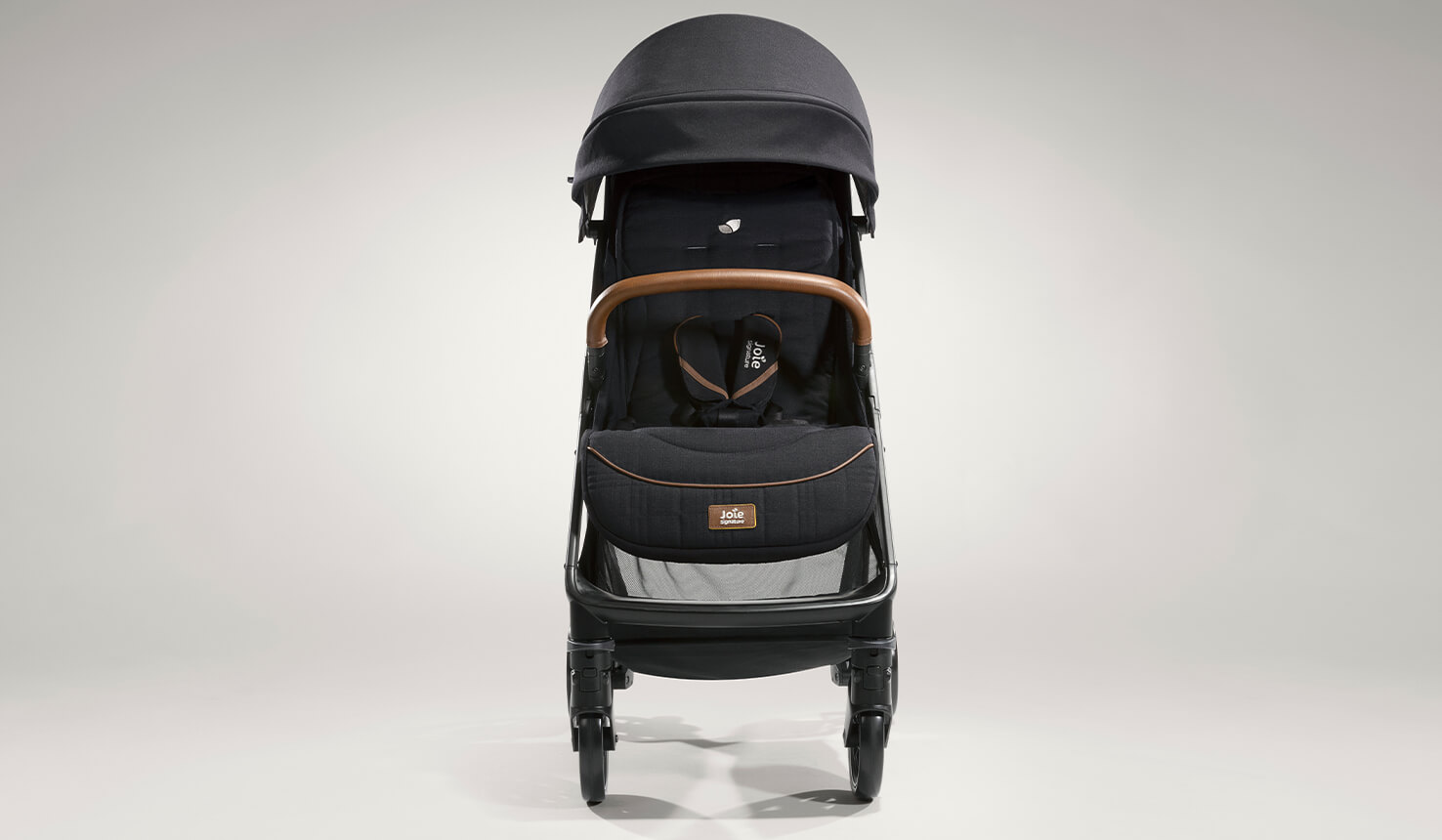  Joie signature lightweight stroller parcel in black facing straight ahead.