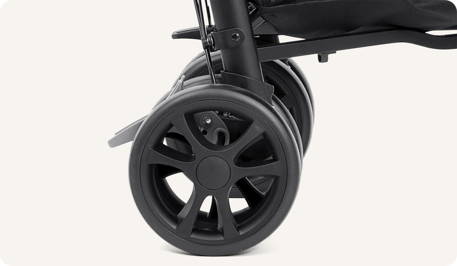 A close up of the wheels and Shoesaver brake for the Joie Brisk in black. 