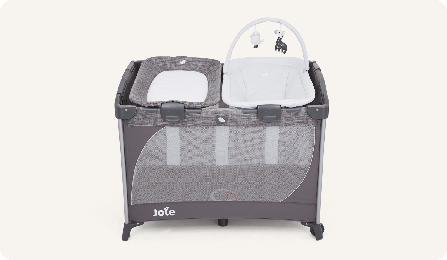 Joie travel cot commuter change & snoozer in grey with a bassinet and changer at side and top view.