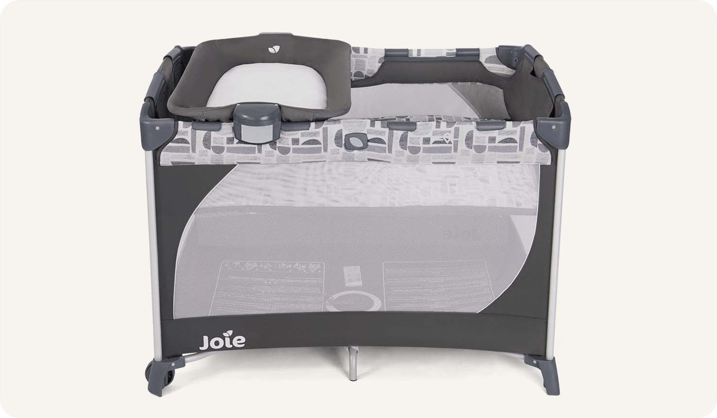 The Joie travel cot commuter change in grey and blue pattern with a bassinet and changer at side and top view.