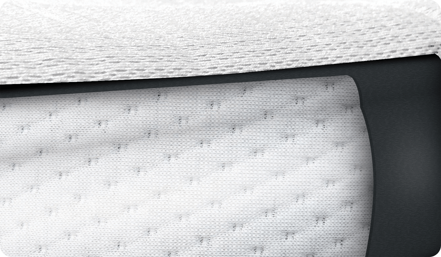 Photo en gros plan du matelas blanc du lit d’appoint Joie roomie glide.