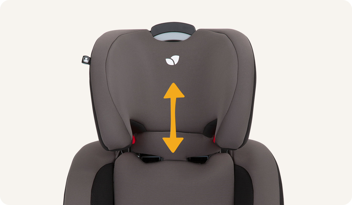 Closeup of a black and gray Joie Every Stage car seat’s headrest fully raised, with an orange double-sided arrow overlaid on the seat.