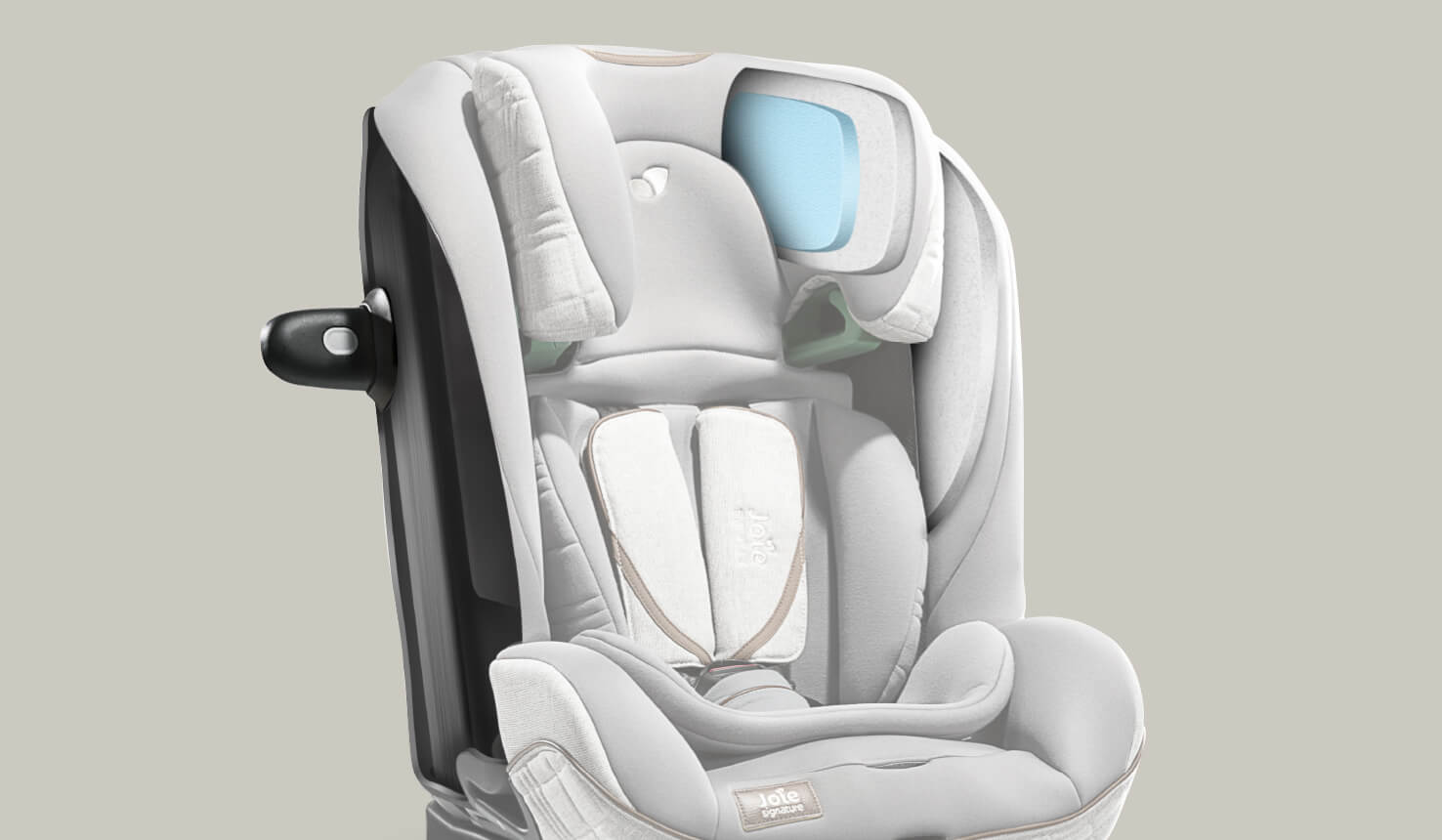 A gray Joie I-Plenti car seat facing at an angle, with a cutout graphic showing the layers of foam inside the headrest.