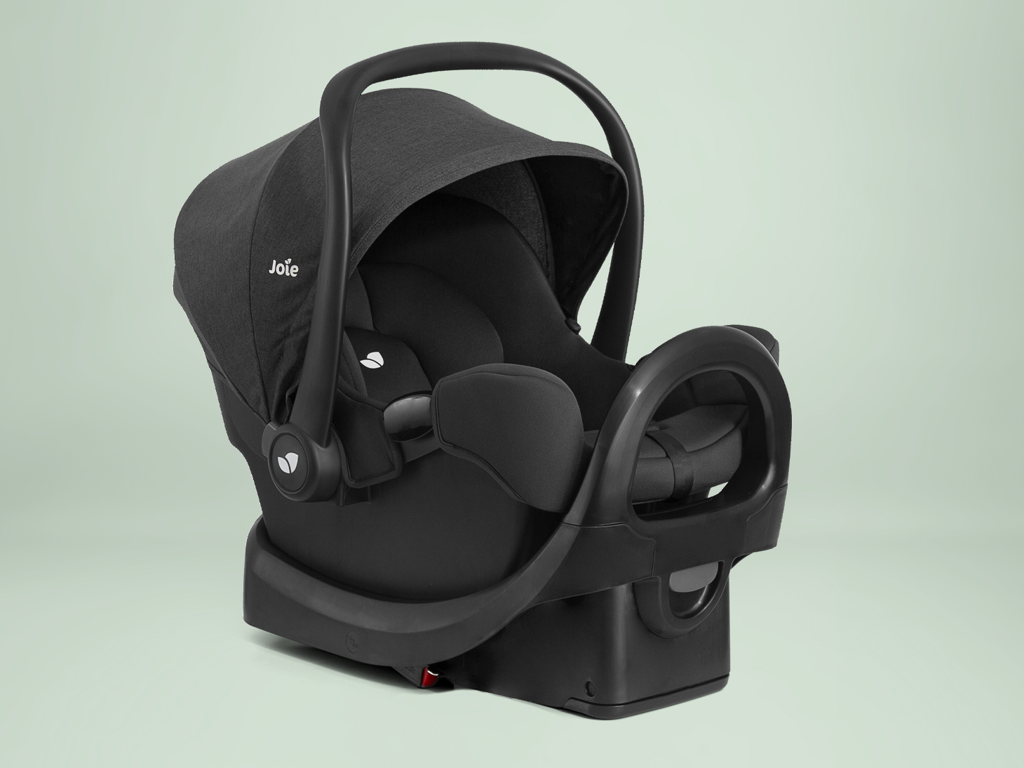 Right angle of rue lightweight infant car seat on rue base on light green background