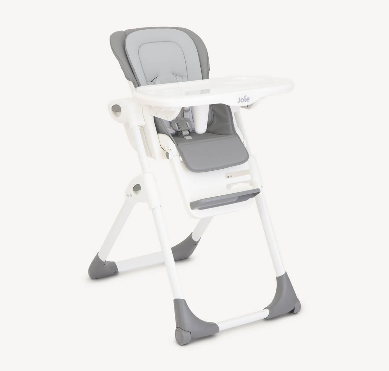 Joie Mimzy Recline highchair with a black frame and tan seat pad, facing at an angle to the right.