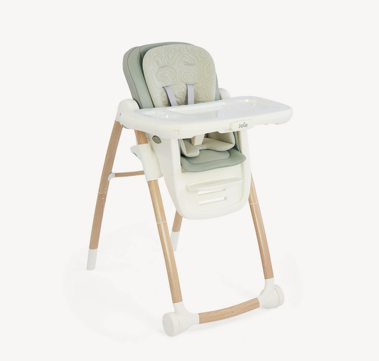 Joie Multiply highchair with a light wood frame and two-tone green seat pad at a right angle.