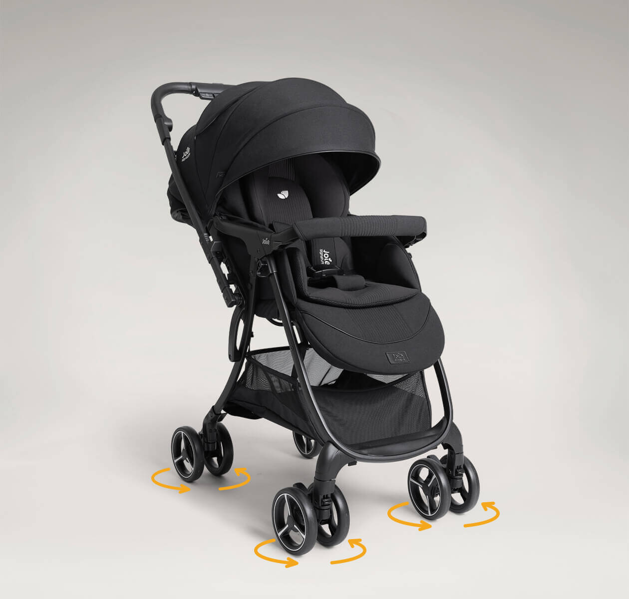 Joie Signature sma baggi 4WD drift, in eclipse black, facing forward angled right with 360° swivel function on all four wheels.
