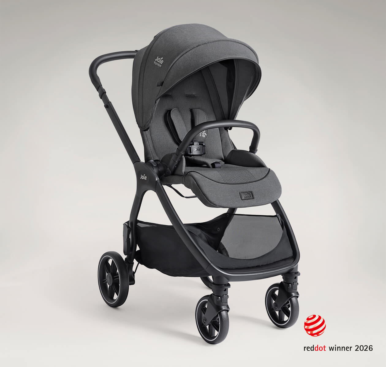 Poussette Joie Signature valora en angle en mode face route, coloris gris, sur fond taupe