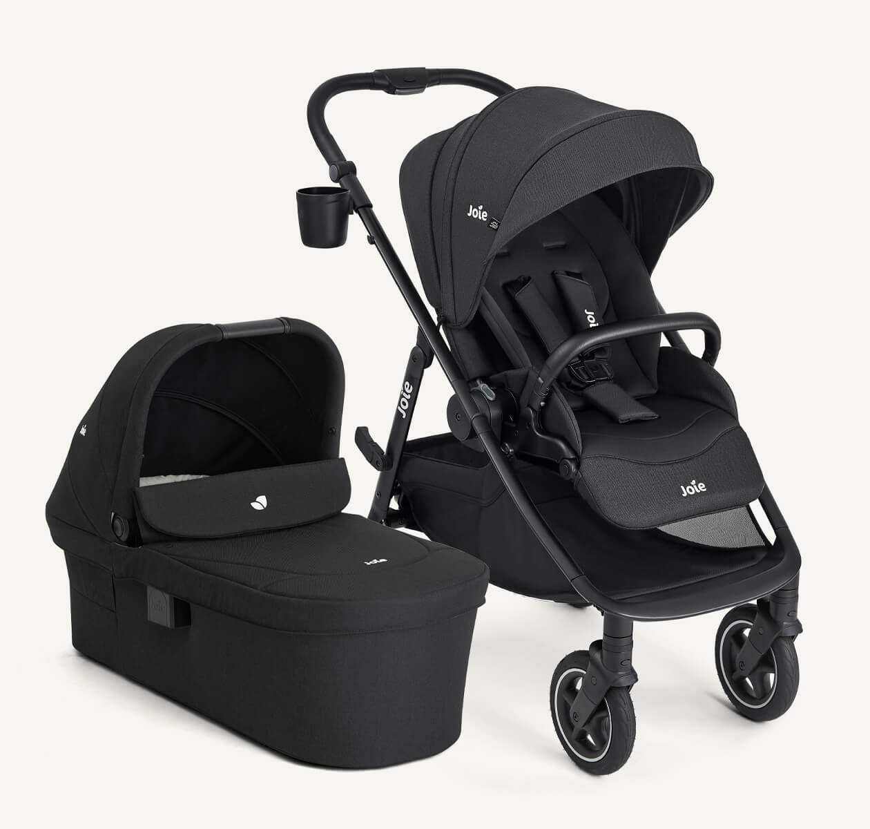 Joie versadrift pushchair and ramble xl carry cot displayed together, all in black.
