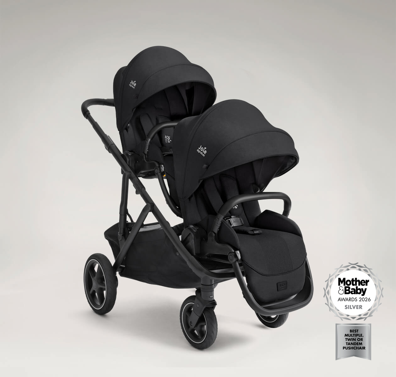 Joie Signature versiti pushchair in black with additional versiti sibling seat attached facing forward. The image also features a logo indicating that the product is a 2026 mother and baby awards silver winner for best multiple, twin or tandem pushchair.