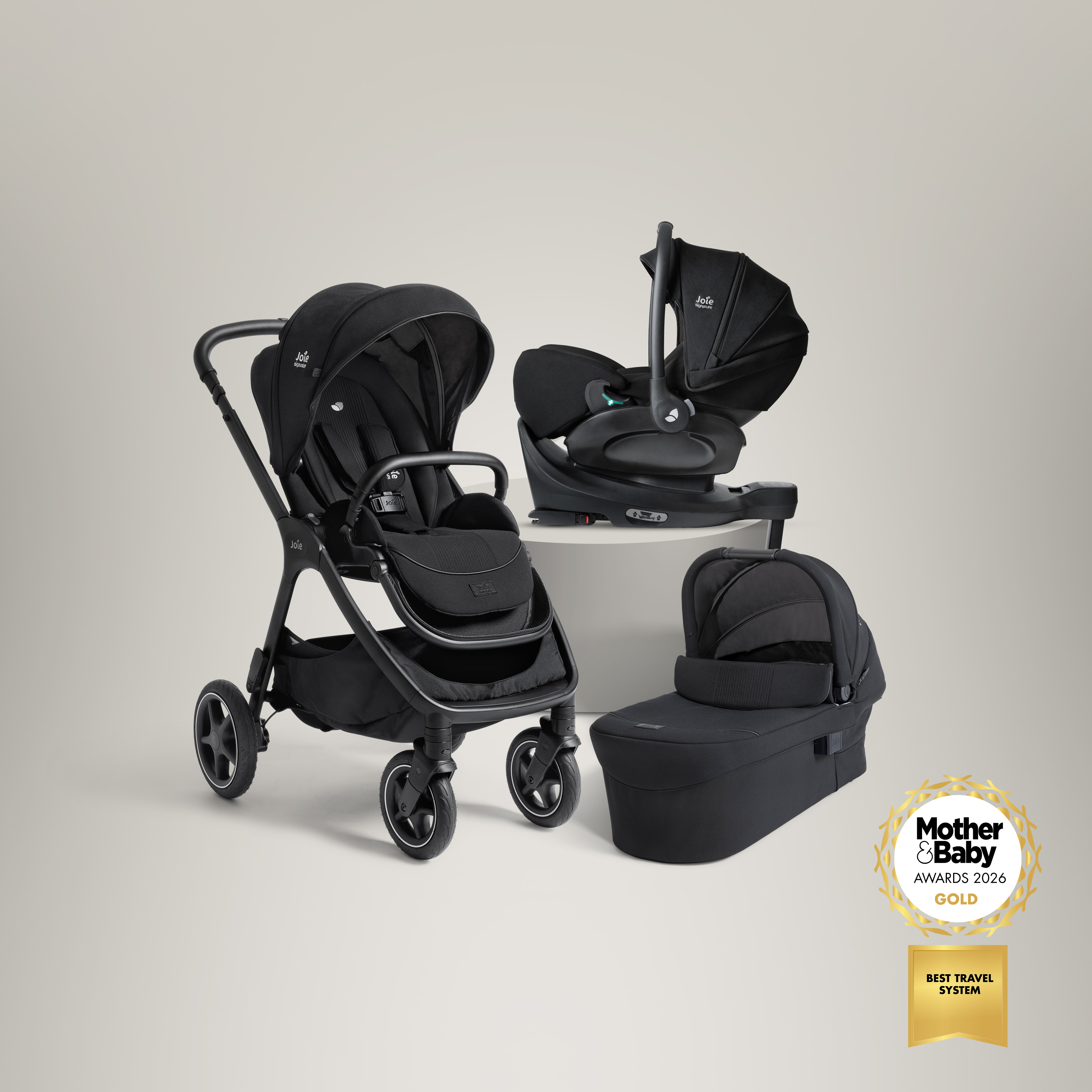 Joie Signature finiti pushchair, i-level pro infant car seat on i-base encore and ramble xl carry cot displayed together as a bundle, all pictures in black.