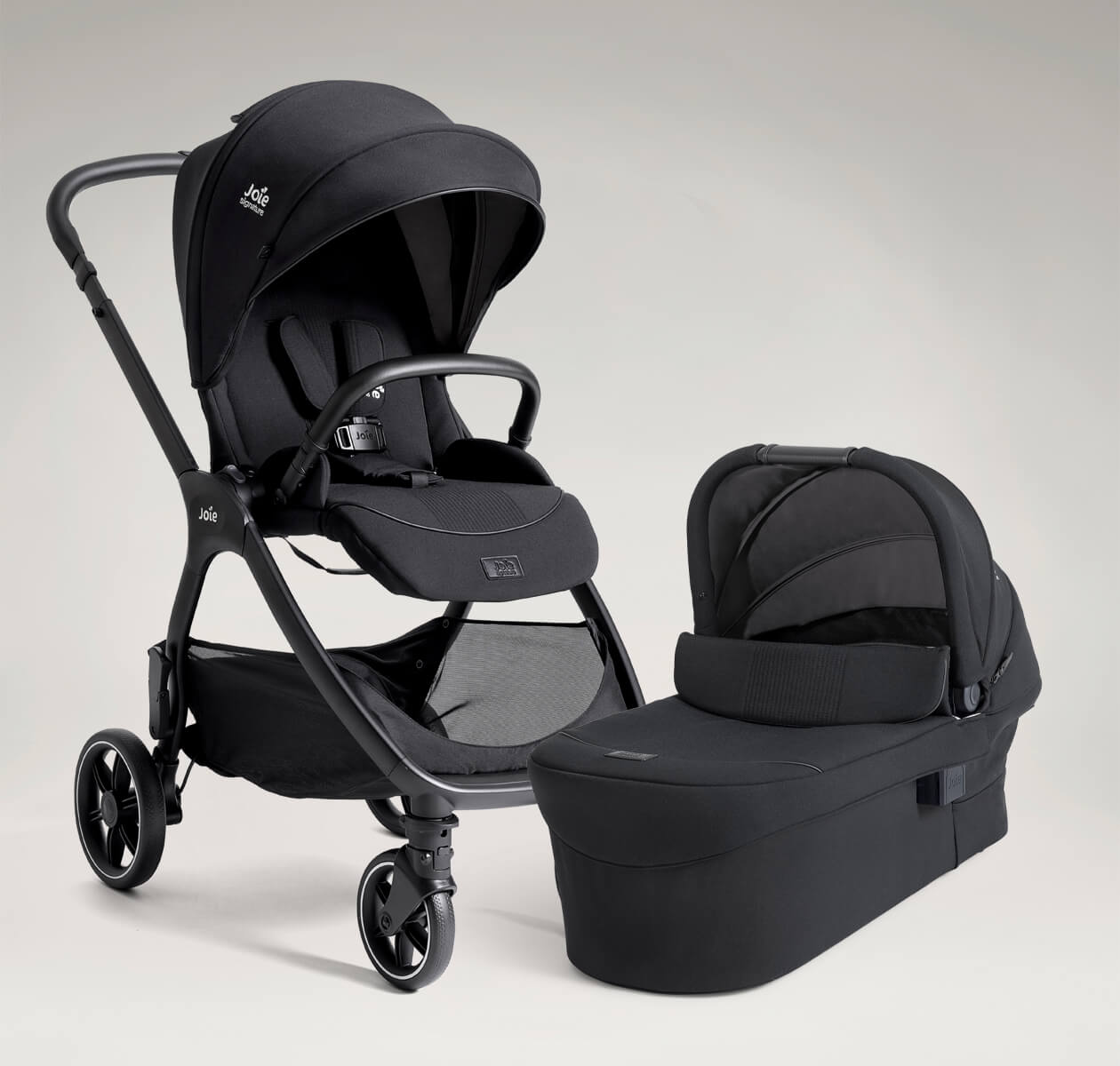 Joie Signature valora pushchair and ramble xl carry cot, both in black.