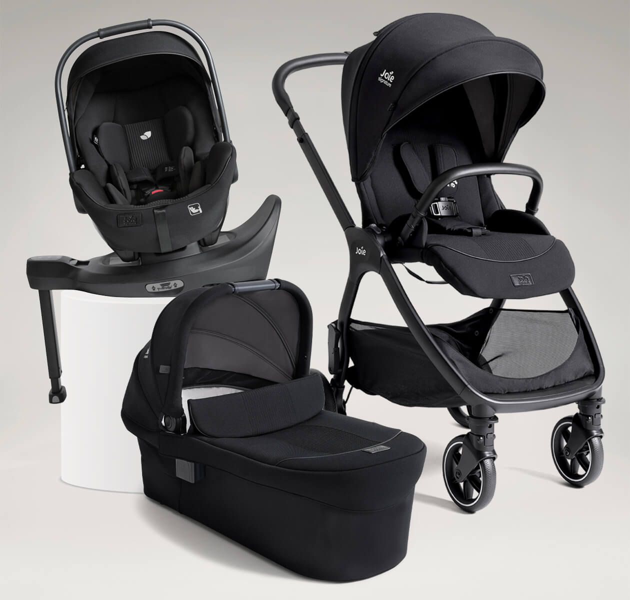 Joie Signature valora travel ready bundle including valora pushchair, i-Level Pro infant car seat, ramble xl carry cot and i-Base encore spinning car seat base, all in black.
