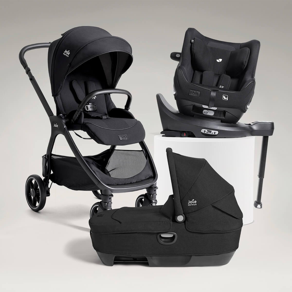 Joie Signature valora grow ready bundle including valora pushchair, i-Harbour E car seat, calmi R129 car cot and i-Base encore spinning car seat base, all in black.
