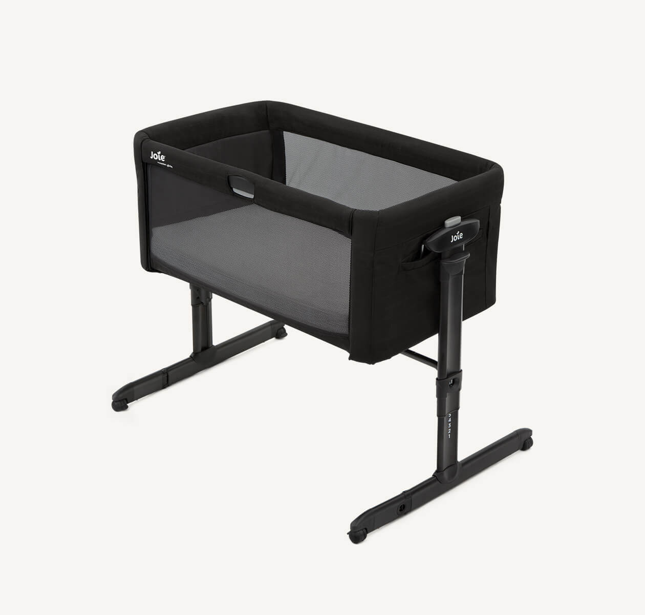 Black Joie roomie glide bedside crib at a right angle.